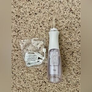 White and Purple Oral Irrigation Appliance